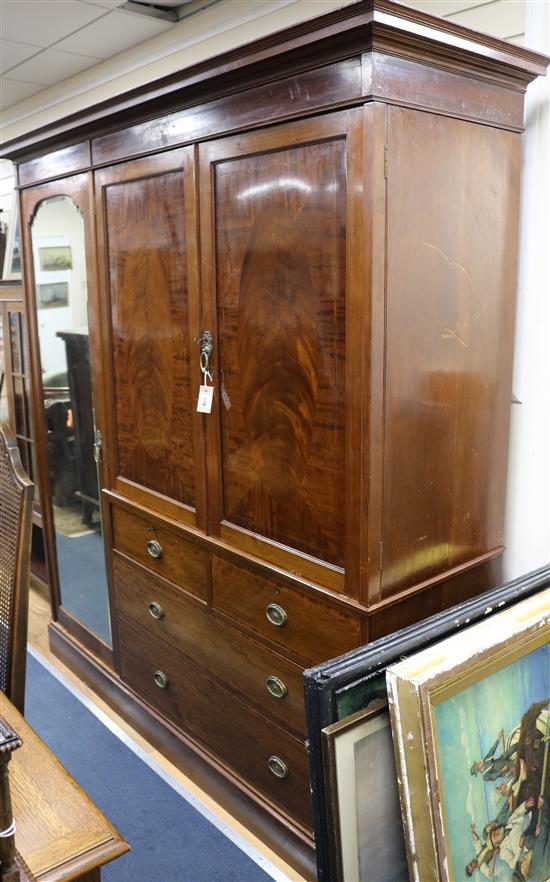 A Shoolbred inlaid mahogany compactum wardrobe W.198cm